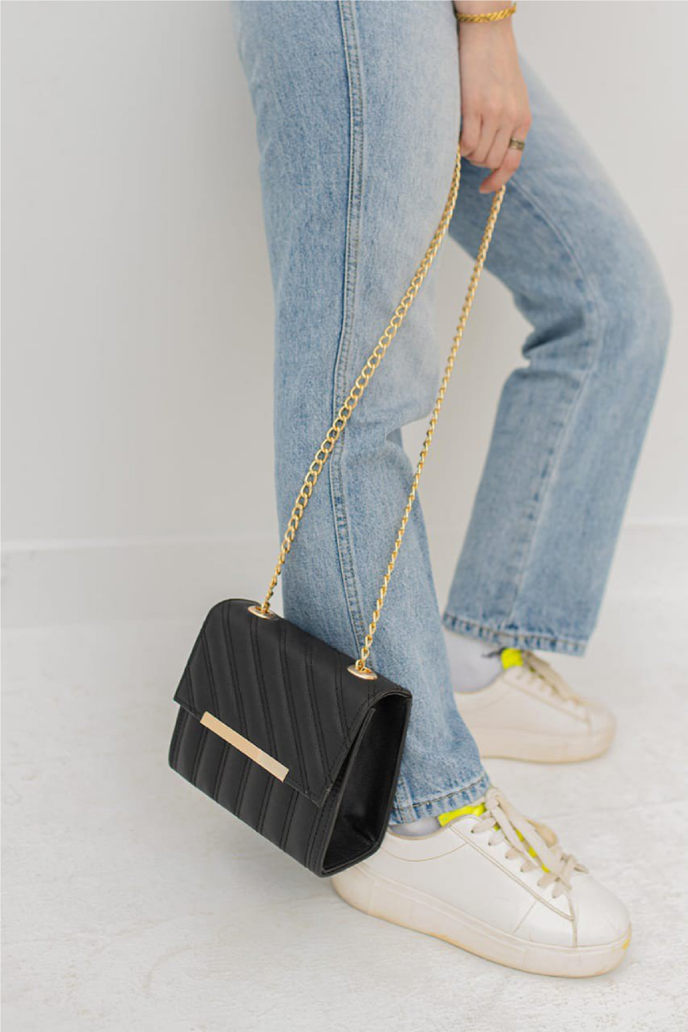 Quilted Black Crossbody Bag with Gold Bar